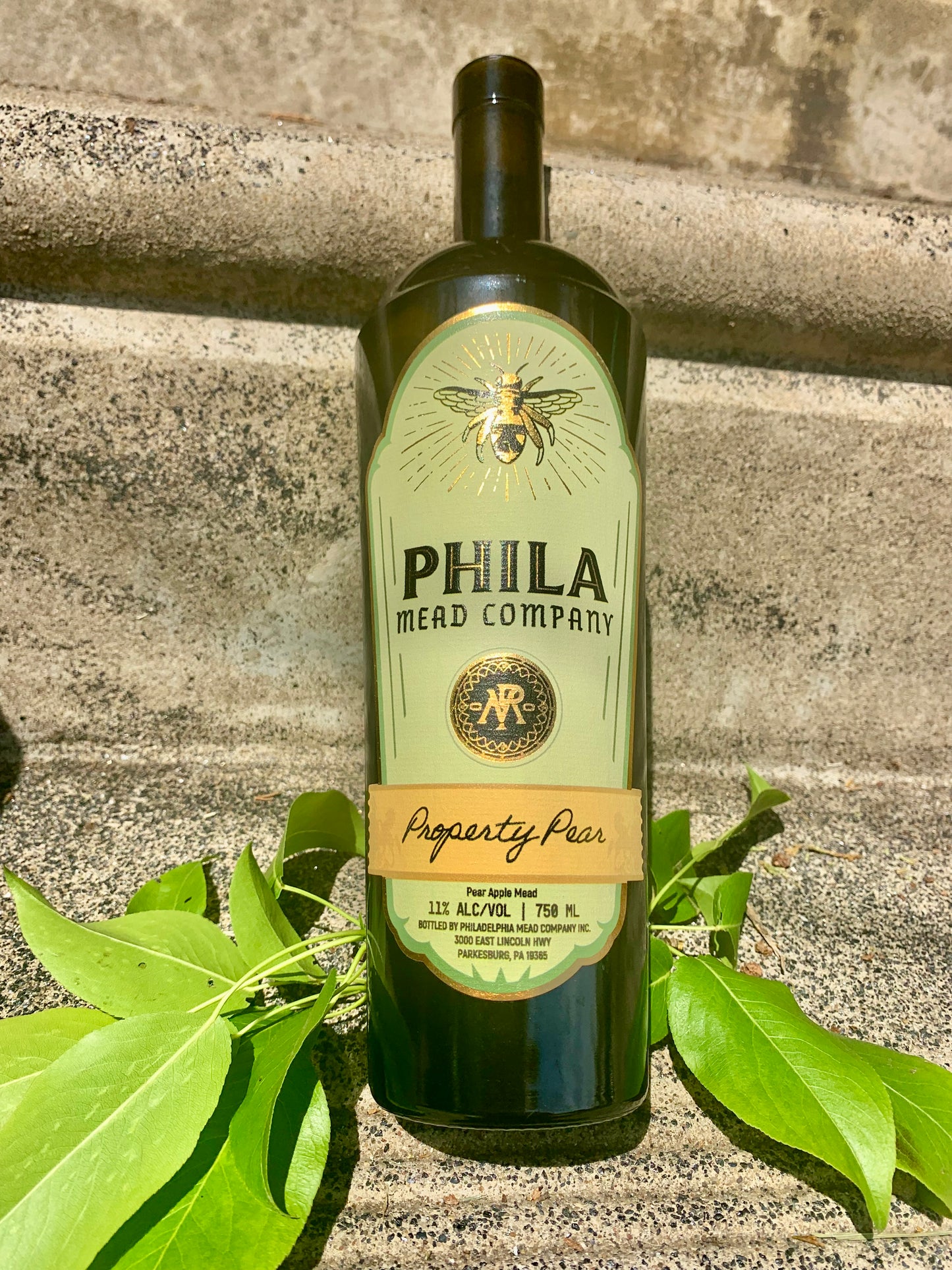 A photo of our Property Pear mead, ensconced by pear leaf laurels.
